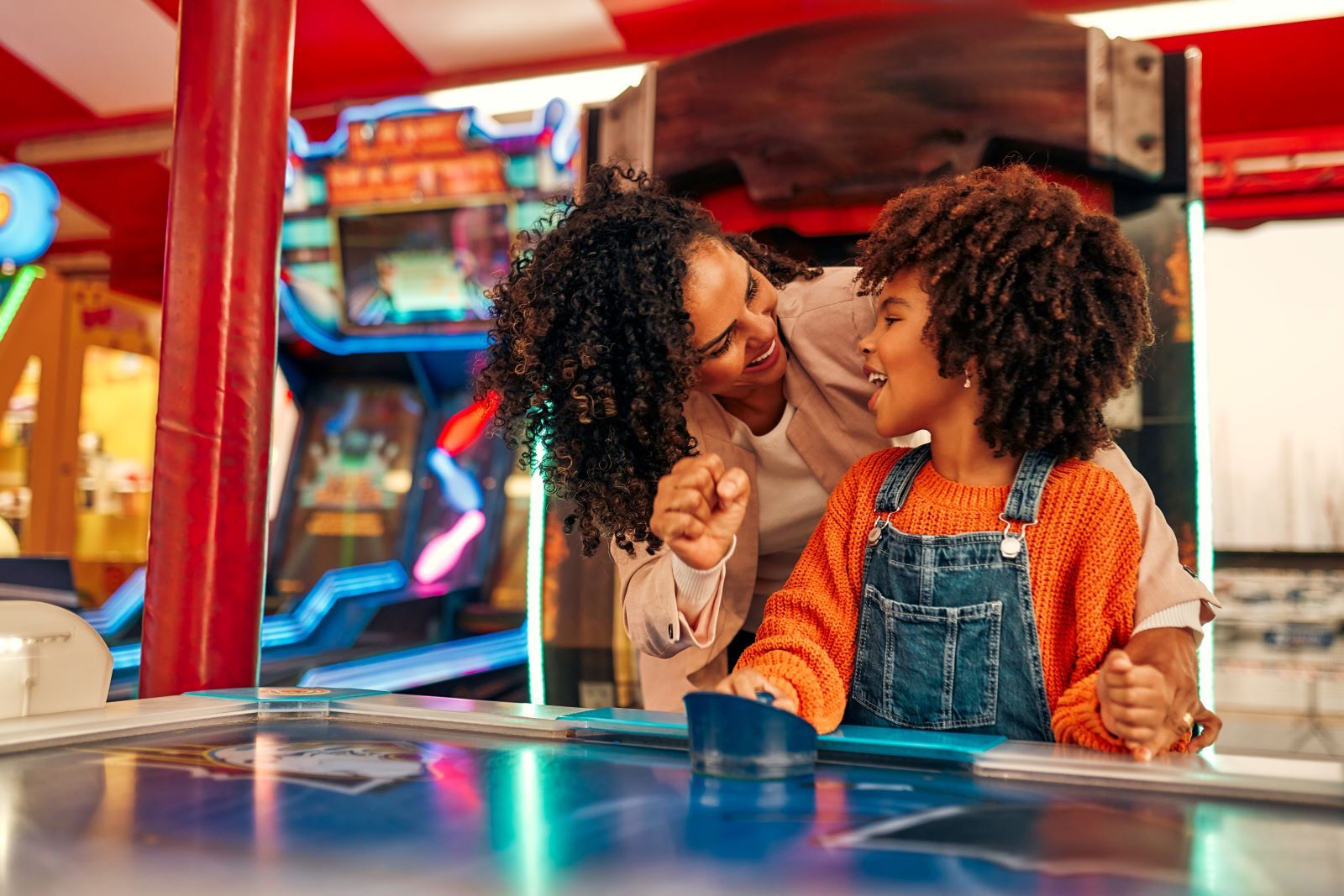 Family playing in a Kure Beach Arcade